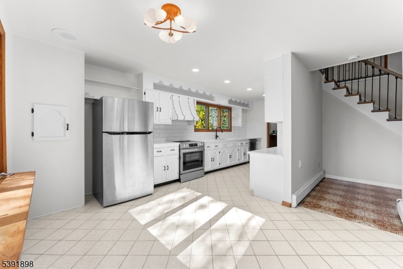 59 Cherryville Stanton Road Flemington, NJ 08822 - Photo 19 of 31 a view of a kitchen with a sink refrigerator and window