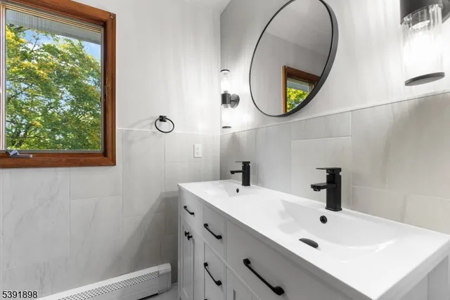 a view of a big room with wooden floor and windows