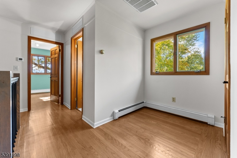 59 Cherryville Stanton Road Flemington, NJ 08822 - Photo 26 of 31 an empty room with a window and a hallway