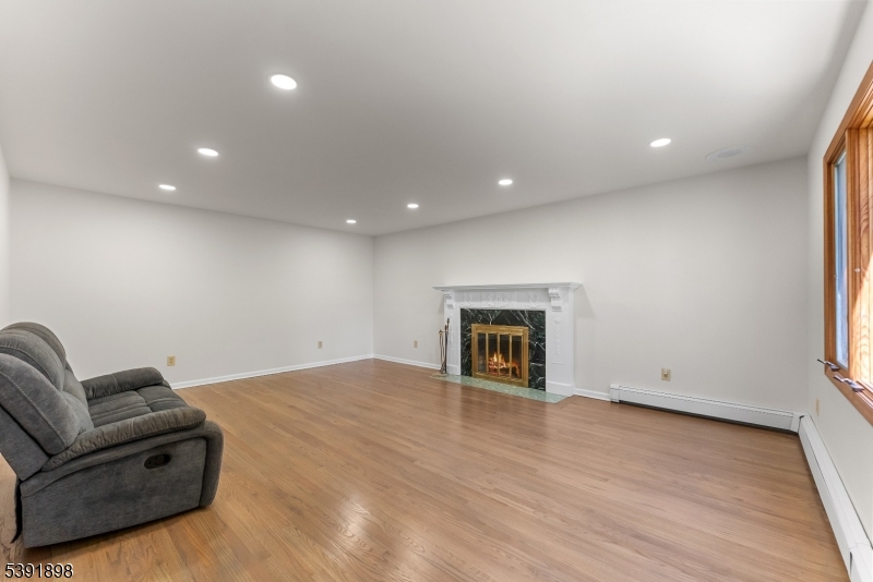 59 Cherryville Stanton Road Flemington, NJ 08822 - Photo 9 of 31 a living room with a couch and a fireplace