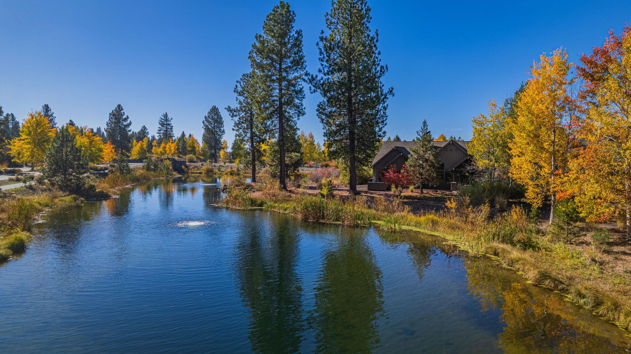 56508 Dancing Rock Loop, Unit 22 Bend, OR 97707 - Photo 65 of 69 a view of a lake with houses