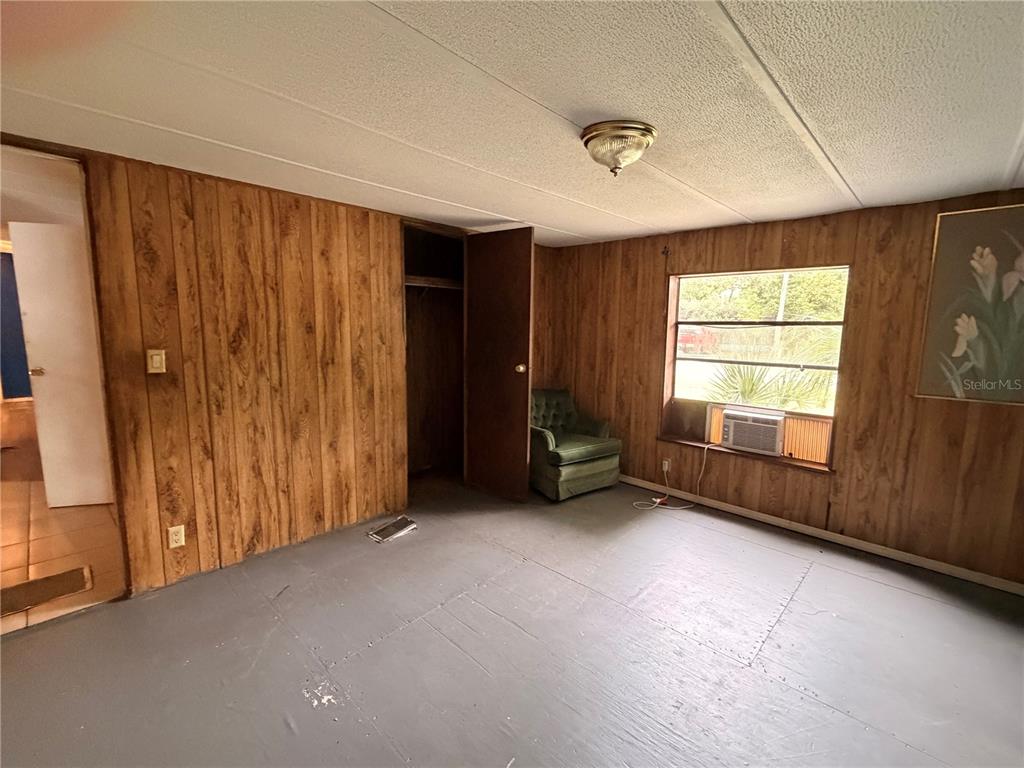 24021 Armadillo Road Astor, FL 32102 - Photo 20 of 38 a view of a livingroom with a fireplace and window