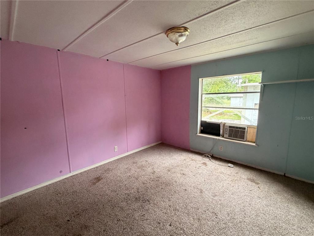 24021 Armadillo Road Astor, FL 32102 - Photo 22 of 38 an empty room with a window