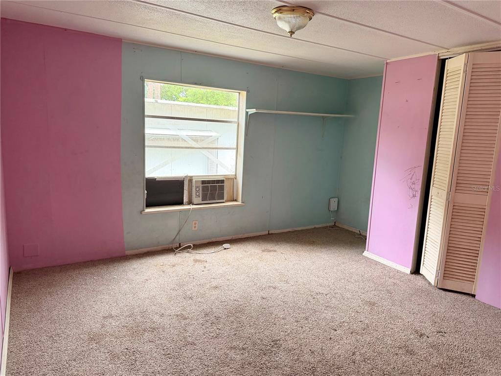 24021 Armadillo Road Astor, FL 32102 - Photo 23 of 38 an empty room with windows