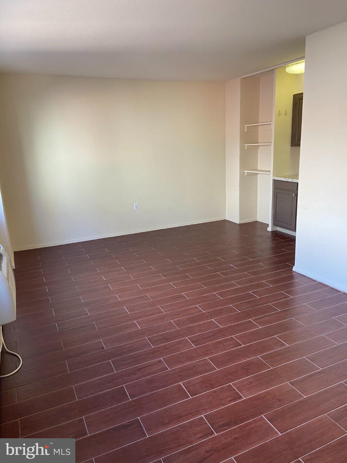2101 Chestnut Street, Unit 706 Philadelphia, PA 19103 - Photo 5 of 9 Spacious room with warm wood tones.