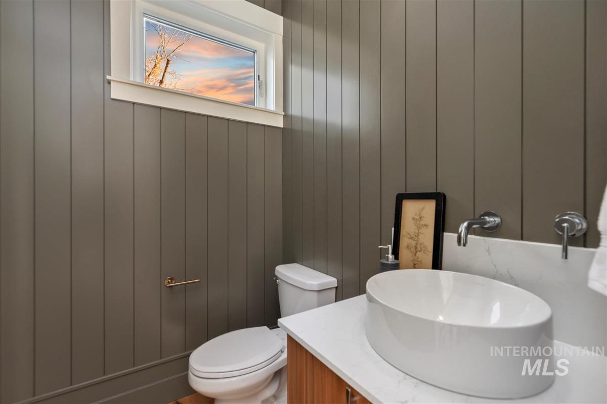 3243 West Moore Street Boise, ID 83702 - Photo 11 of 38 Bathroom with vanity and wooden walls