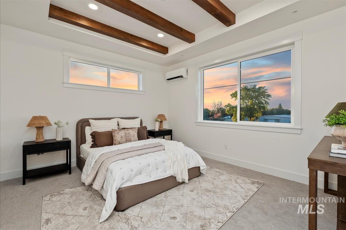 3243 West Moore Street Boise, ID 83702 - Photo 13 of 38 Bedroom with beamed ceiling, light carpet, a wall mounted air conditioner, and recessed lighting