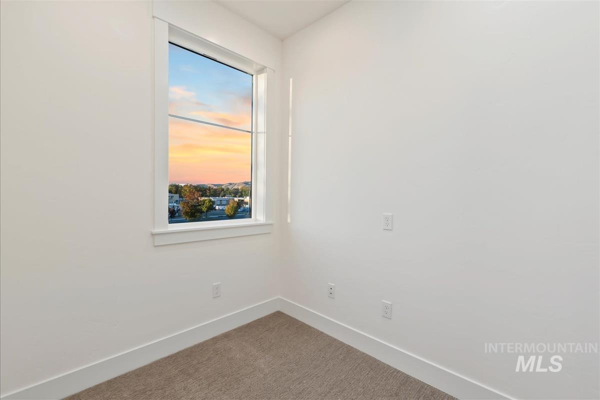 3243 West Moore Street Boise, ID 83702 - Photo 15 of 38 Carpeted empty room with baseboards