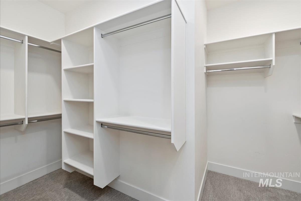 3243 West Moore Street Boise, ID 83702 - Photo 22 of 38 Walk in closet featuring light carpet