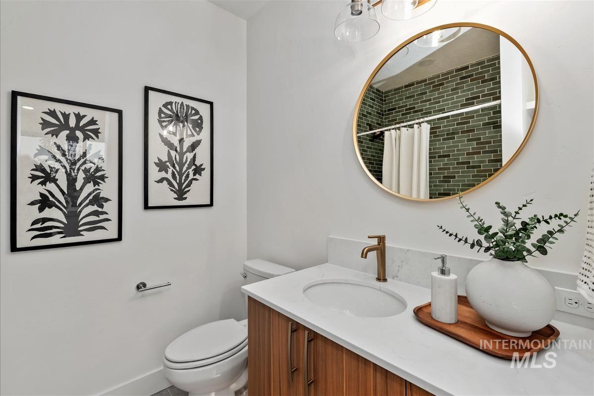 3243 West Moore Street Boise, ID 83702 - Photo 26 of 38 Full bath featuring a tile shower and vanity