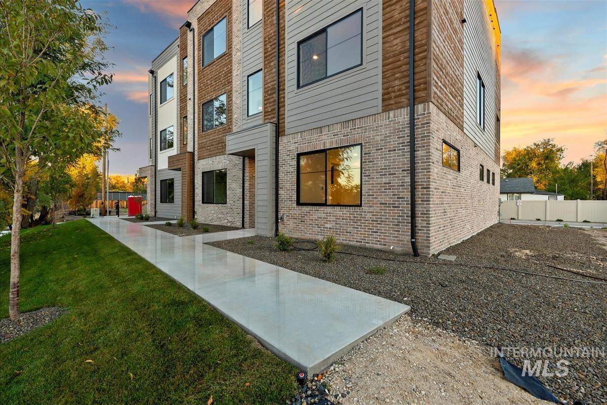 3243 West Moore Street Boise, ID 83702 - Photo 29 of 38 Property exterior at dusk featuring brick siding