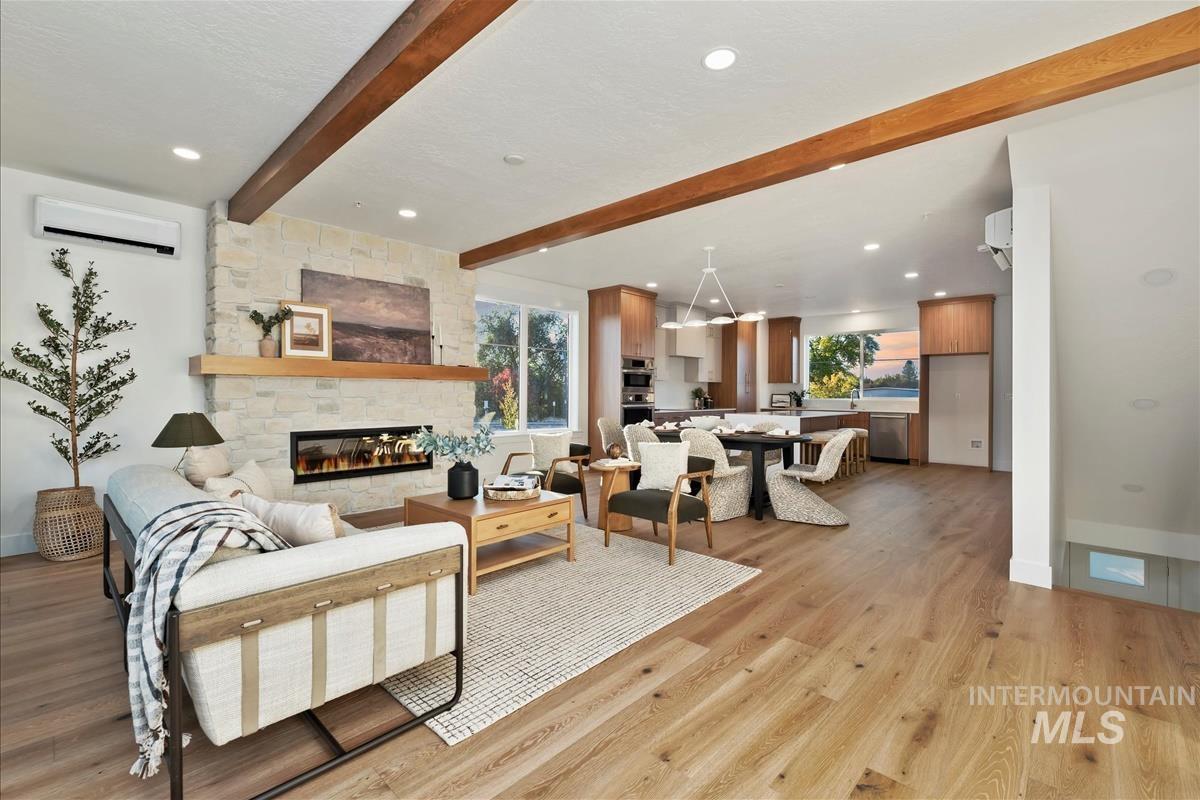 3243 West Moore Street Boise, ID 83702 - Photo 5 of 38 Living area with beamed ceiling, healthy amount of natural light, recessed lighting, light wood-type flooring, and an AC wall unit