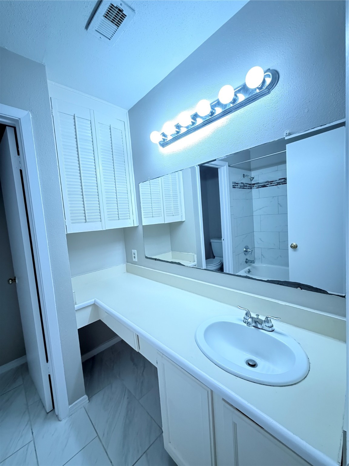 12847 Briarwest Circle Houston, TX 77077 - Photo 19 of 21 a bathroom with a sink and a mirror