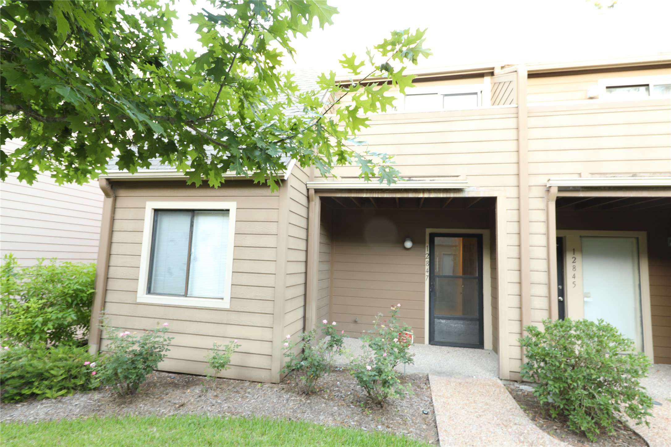 12847 Briarwest Circle Houston, TX 77077 - Photo 2 of 21 a front view of a house with an outdoor space