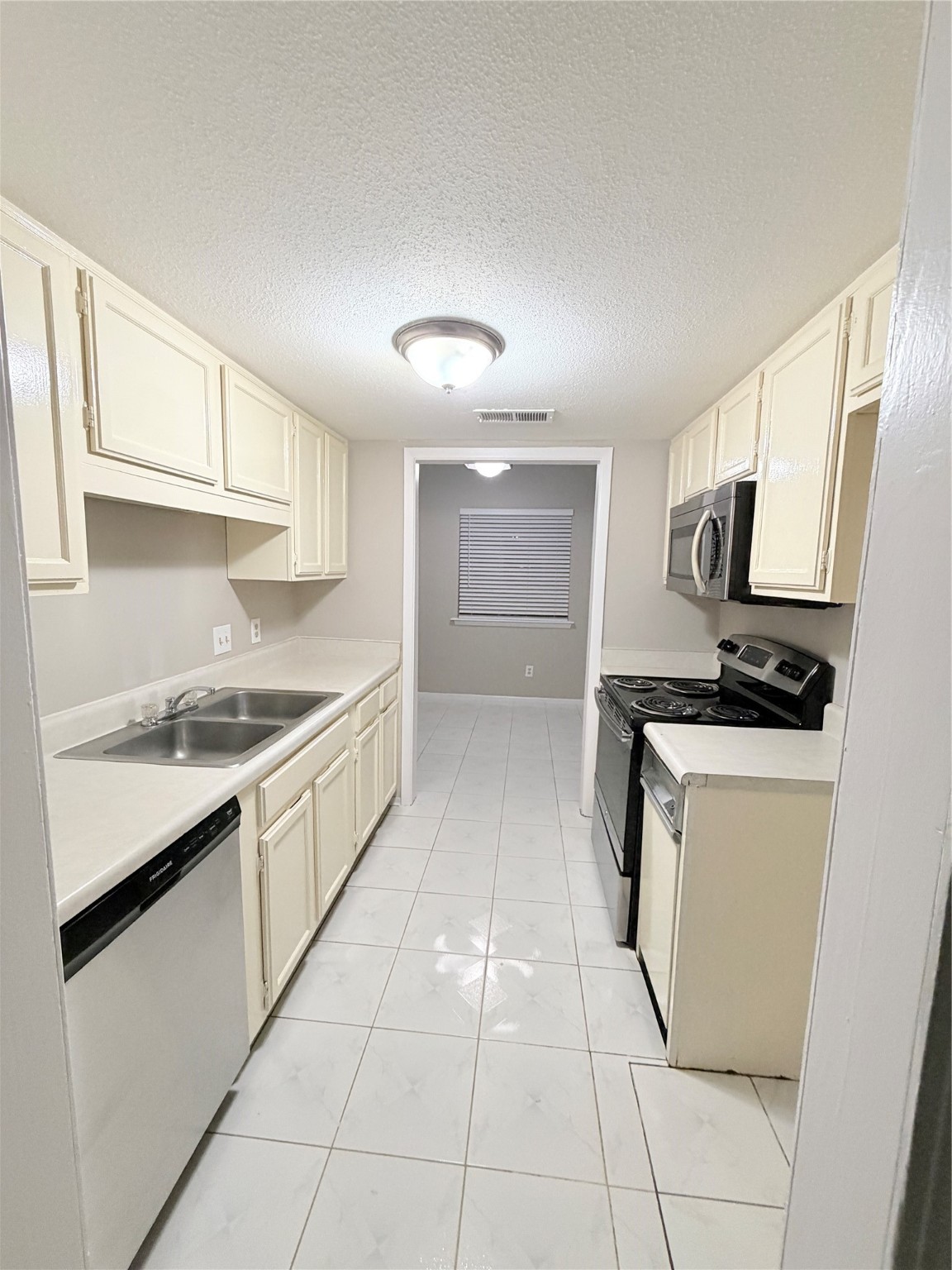 12847 Briarwest Circle Houston, TX 77077 - Photo 7 of 21 a kitchen with a sink cabinets and appliances