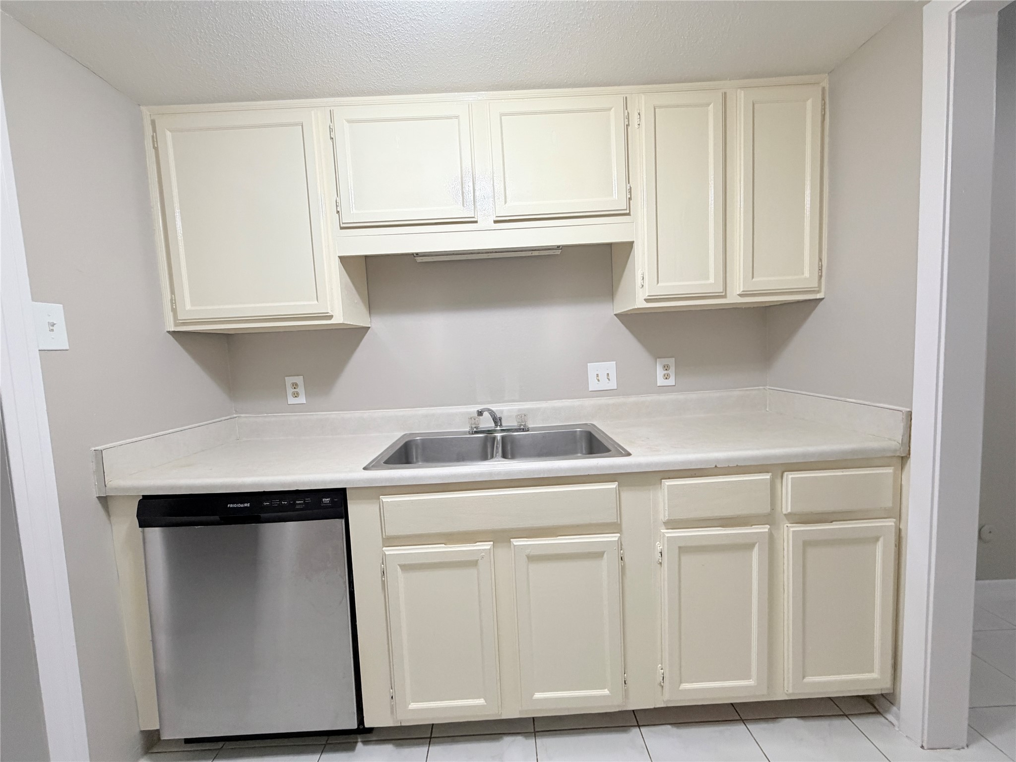 12847 Briarwest Circle Houston, TX 77077 - Photo 9 of 21 a kitchen with white cabinets and sink
