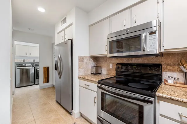 a bathroom with a toilet a sink and shower