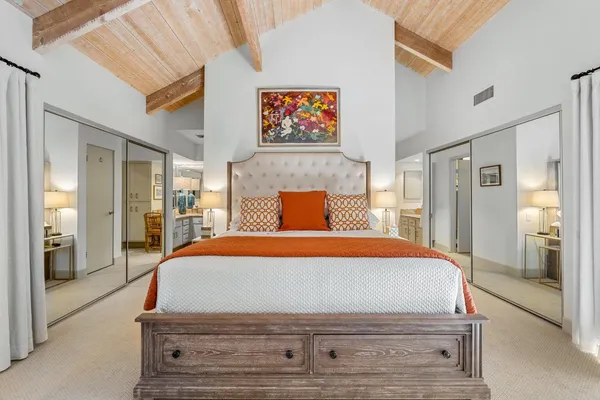 a bedroom with two beds and a couch