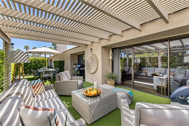 a outdoor living space with furniture and garden view