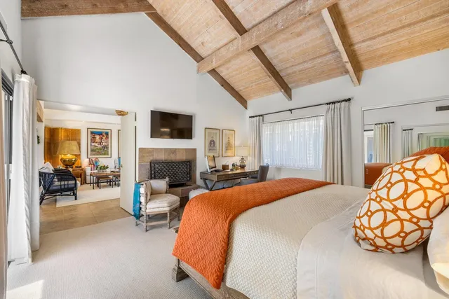 an aerial view of a house with a yard and swimming pool