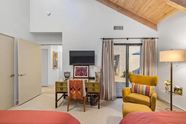 an outdoor space with pool and furniture