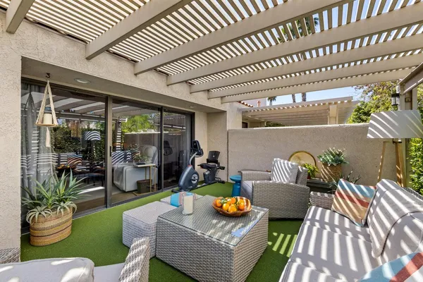 a outdoor living space with furniture and a fireplace