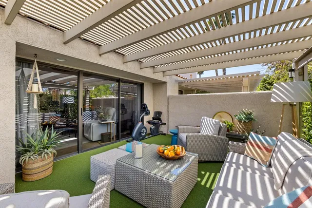 a outdoor living space with furniture and a fireplace