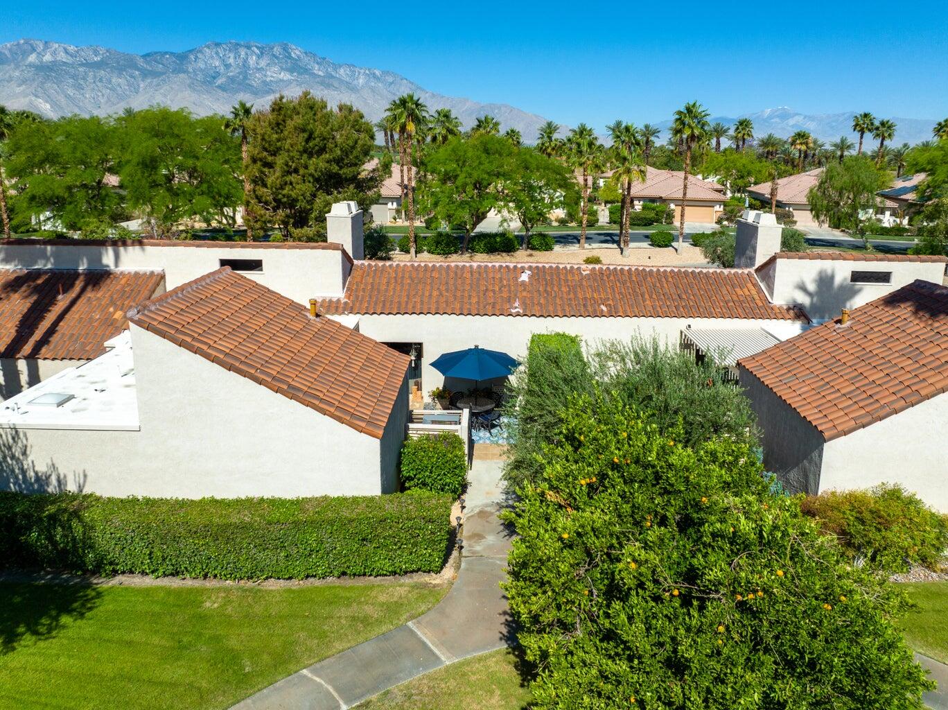 303 Forest Hills Drive Rancho Mirage, CA 92270 - Photo 44 of 71 a view of a yard and front view of a house