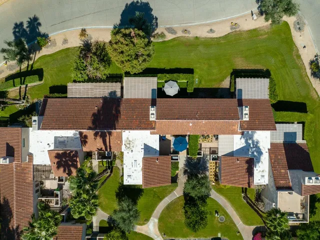 a street sign that is in front of flowers