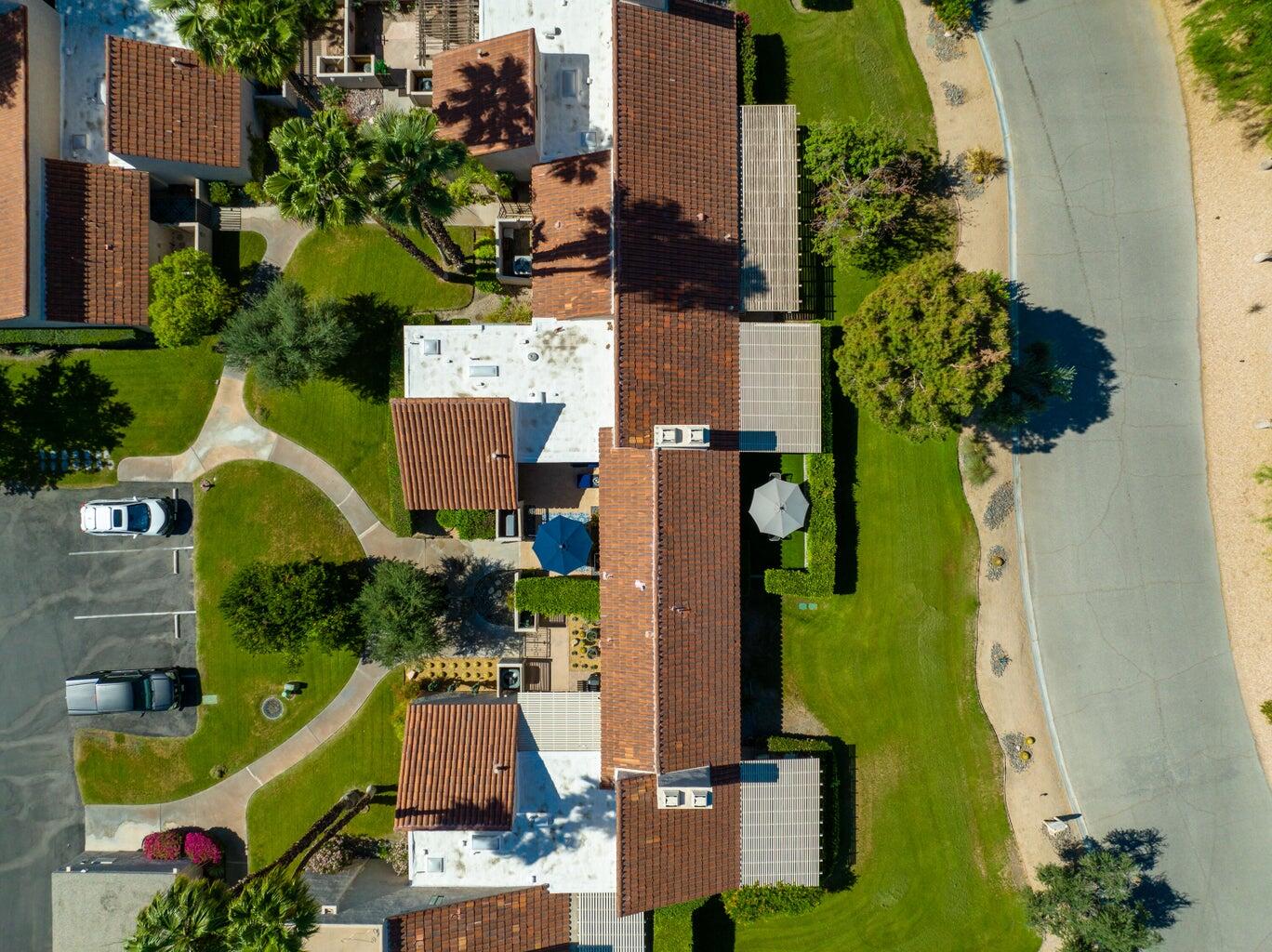 303 Forest Hills Drive Rancho Mirage, CA 92270 - Photo 47 of 71 an aerial view of a house with a yard and swimming pool