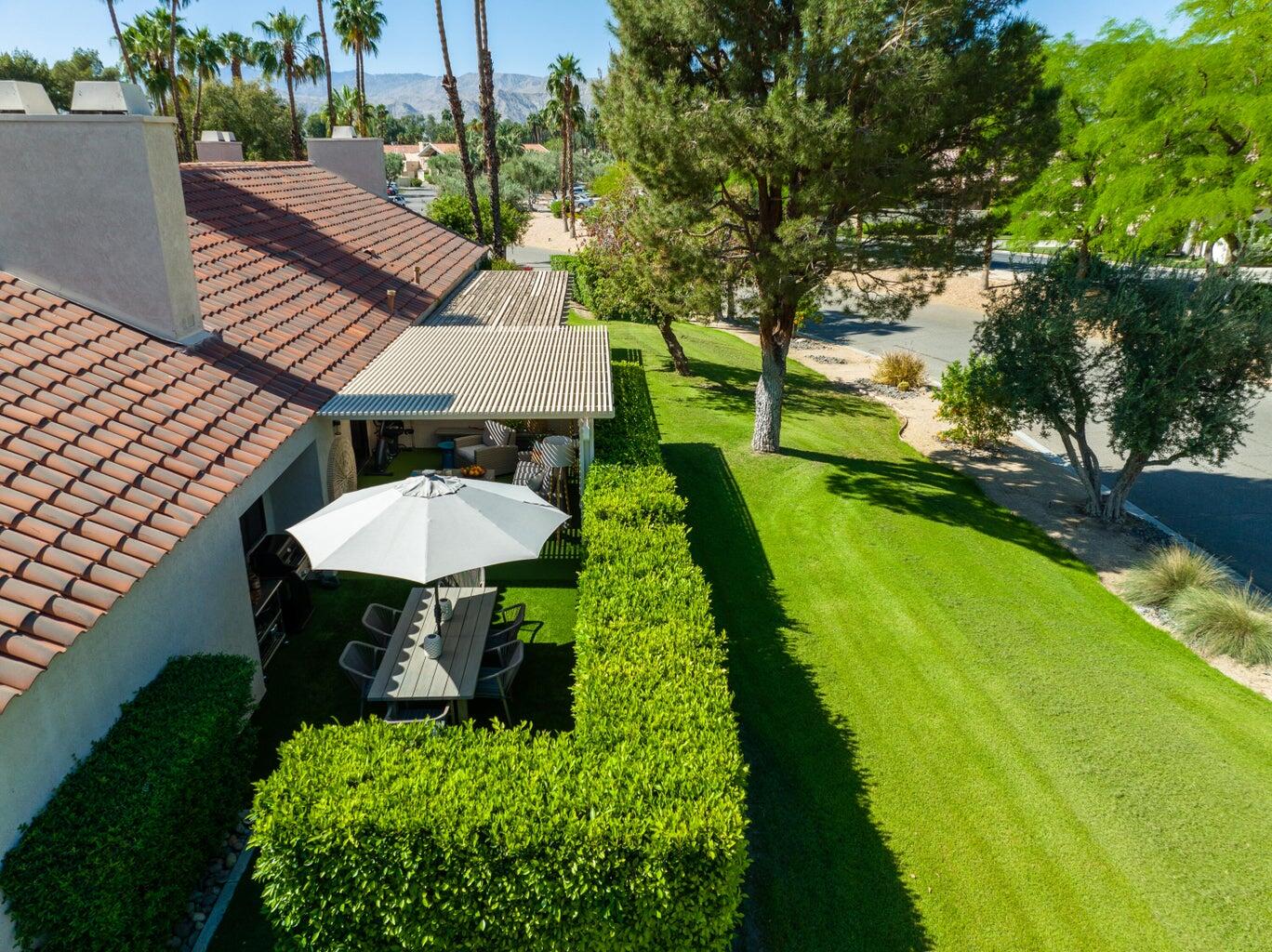 303 Forest Hills Drive Rancho Mirage, CA 92270 - Photo 49 of 71 a view of a table and chairs in patio