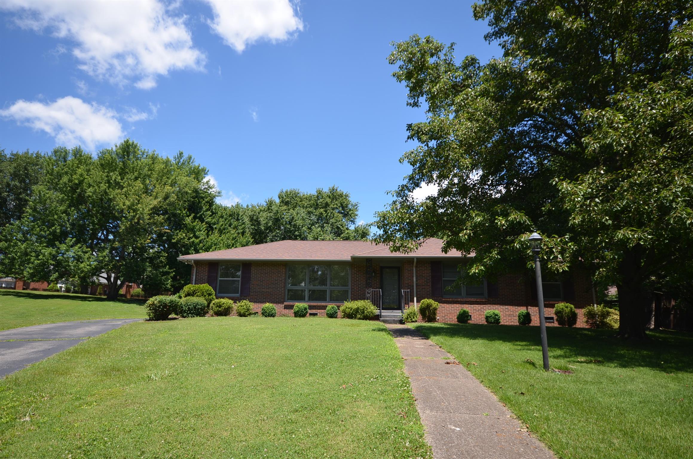 310 Kimbrough Road Clarksville, TN 37043 - Photo 2 of 25 a front view of a house with garden and trees