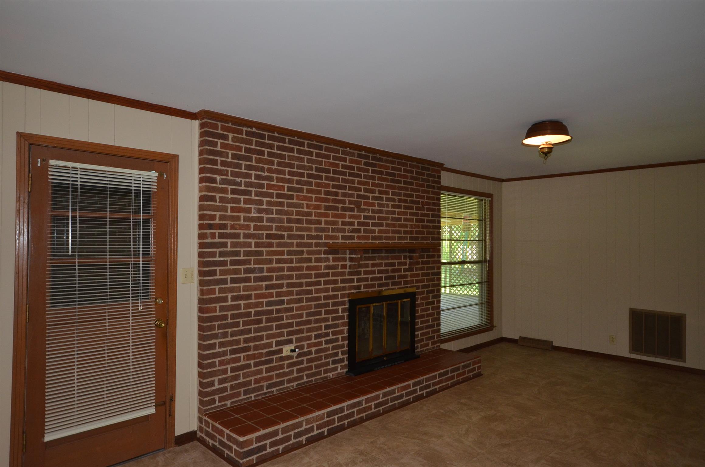 310 Kimbrough Road Clarksville, TN 37043 - Photo 11 of 25 a view of an empty room with a fireplace