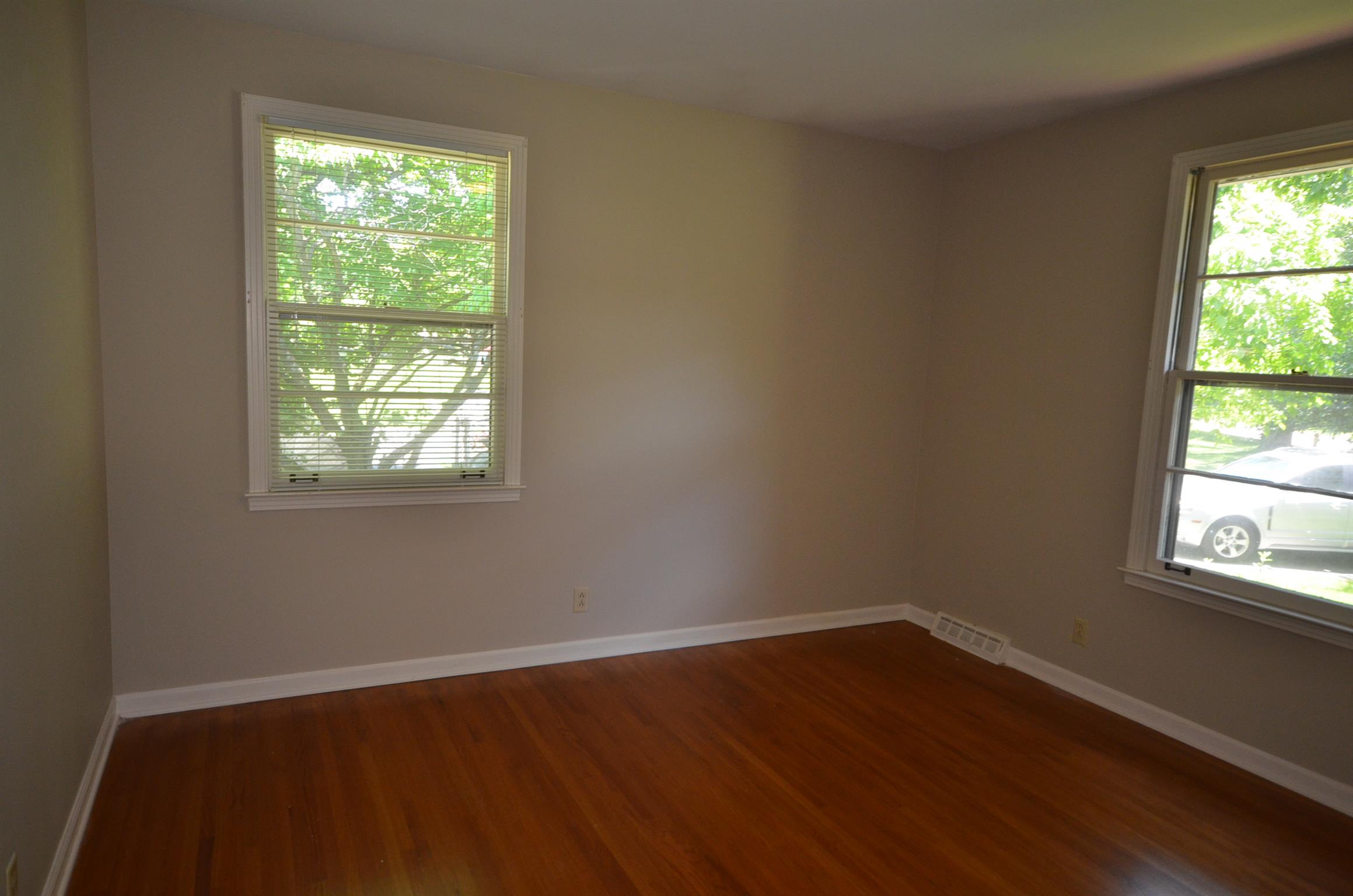 310 Kimbrough Road Clarksville, TN 37043 - Photo 15 of 25 an empty room with wooden floor and windows
