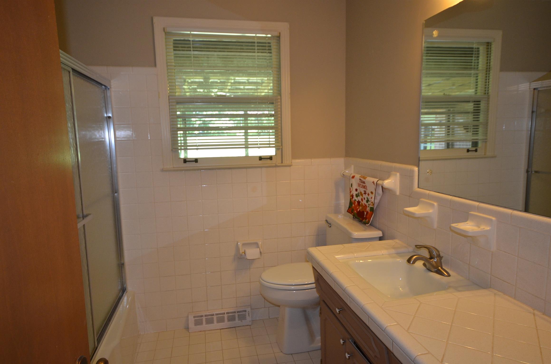 310 Kimbrough Road Clarksville, TN 37043 - Photo 16 of 25 a bathroom with a sink a toilet and a window