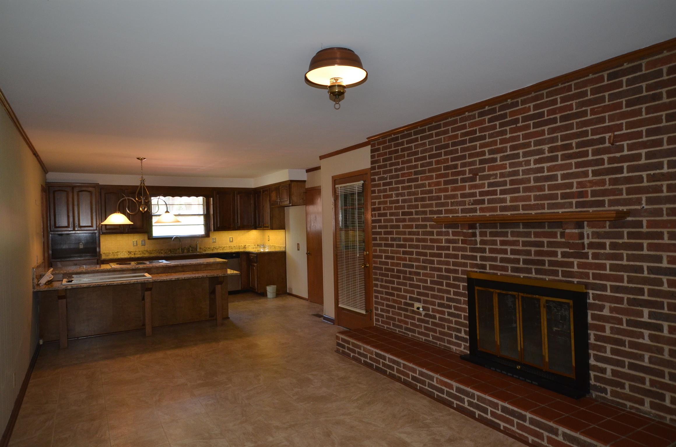 310 Kimbrough Road Clarksville, TN 37043 - Photo 9 of 25 a kitchen with a sink and a stove top oven
