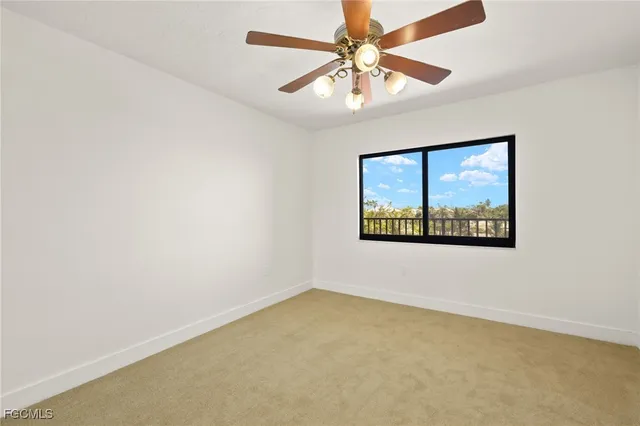 a view of a livingroom with a ceiling fan