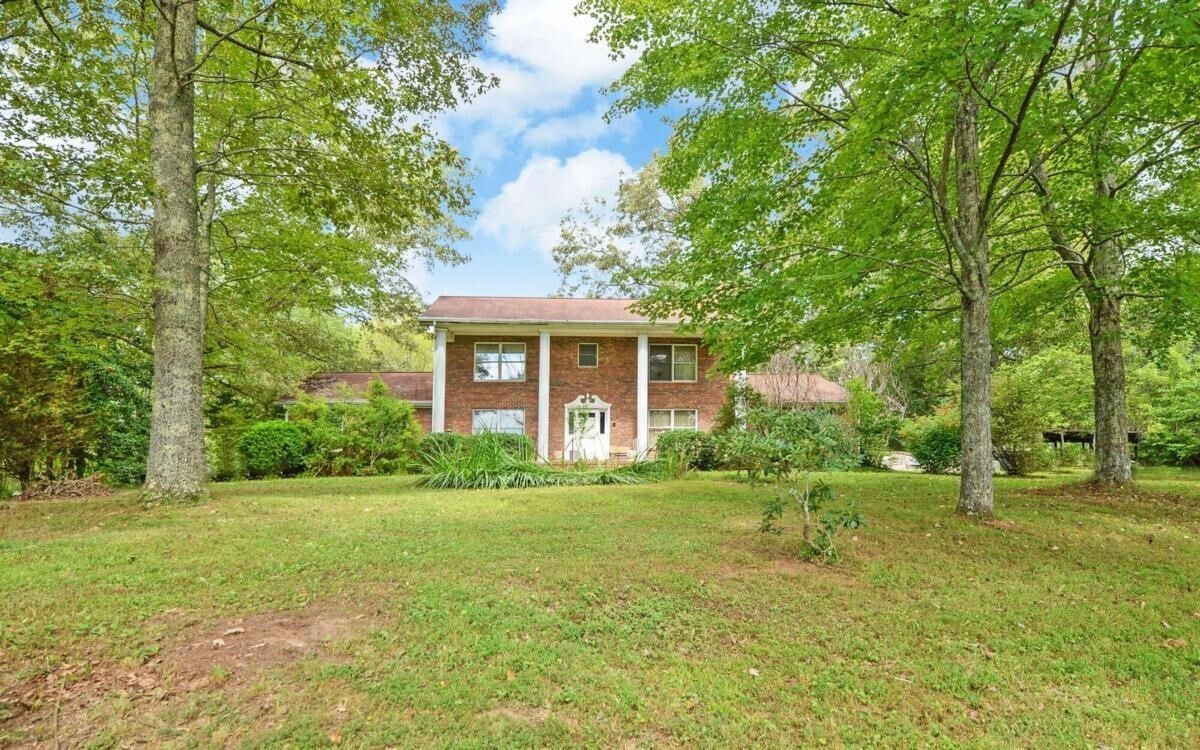 427 Hall Road Turtletown, TN 37391 - Photo 1 of 1 a front view of a house with a yard