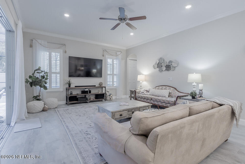 191 Enrede Lane St. Augustine, FL 32095 - Photo 14 of 44 a living room with furniture and a flat screen tv
