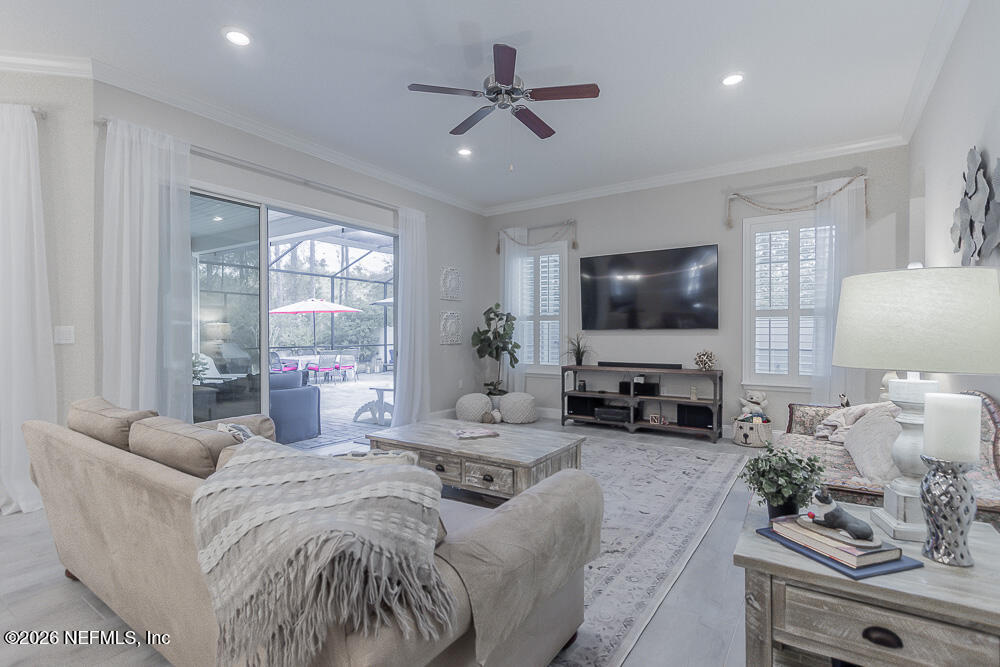 191 Enrede Lane St. Augustine, FL 32095 - Photo 15 of 44 a living room with furniture and a flat screen tv