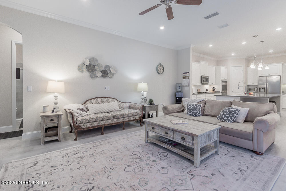 191 Enrede Lane St. Augustine, FL 32095 - Photo 16 of 44 a spacious bedroom with a bed and ceiling fan