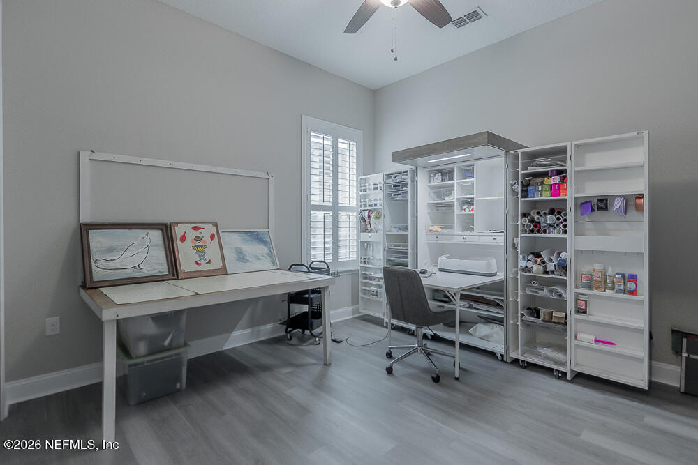 191 Enrede Lane St. Augustine, FL 32095 - Photo 20 of 44 a view of a workspace with furniture and a window
