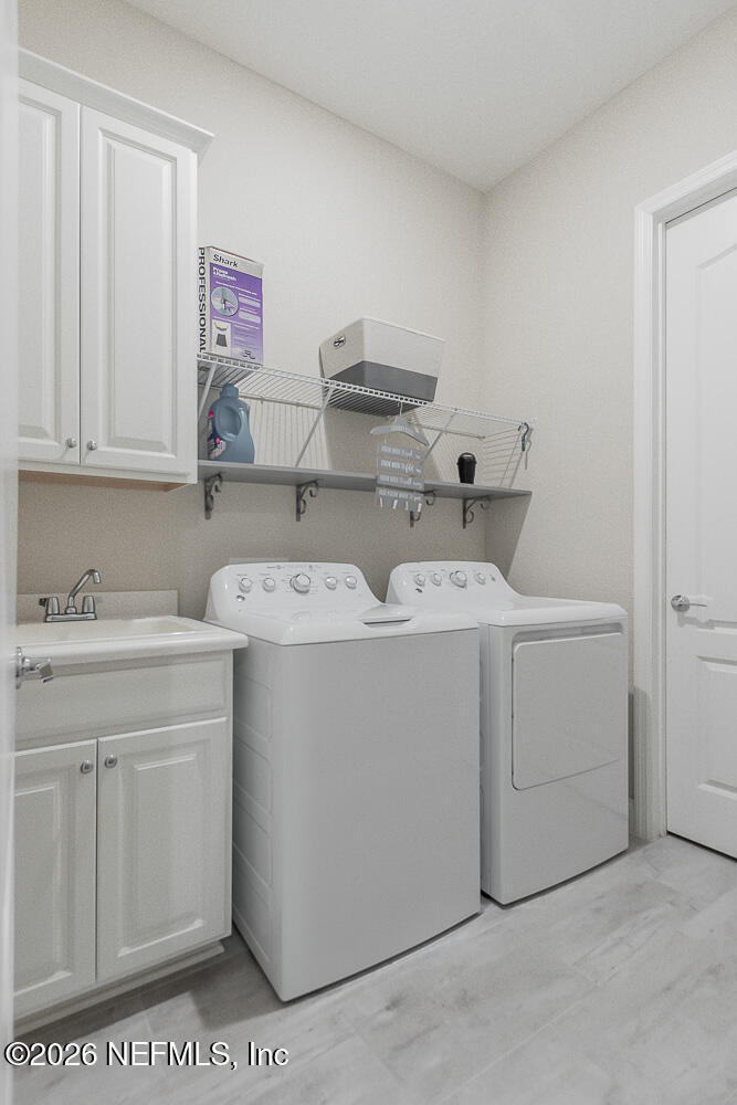 191 Enrede Lane St. Augustine, FL 32095 - Photo 21 of 44 a utility room with dryer and washer