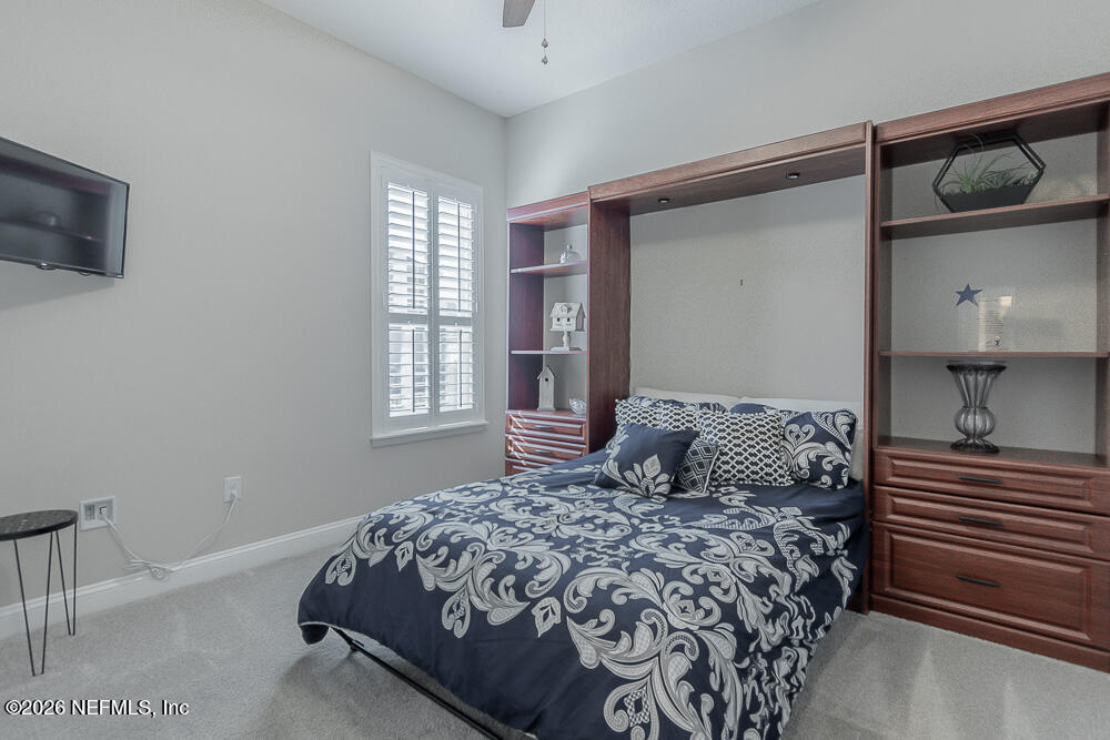 191 Enrede Lane St. Augustine, FL 32095 - Photo 23 of 44 a bedroom with a bed and flat screen tv