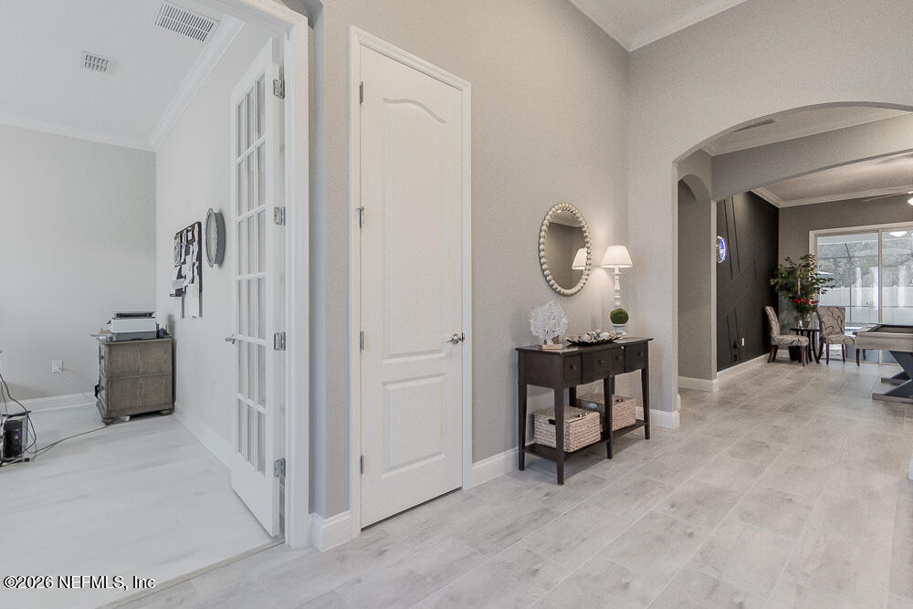 191 Enrede Lane St. Augustine, FL 32095 - Photo 3 of 44 a view of a hallway with livingroom and furniture