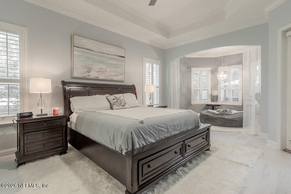 191 Enrede Lane St. Augustine, FL 32095 - Photo 31 of 44 a spacious bedroom with a bed and window