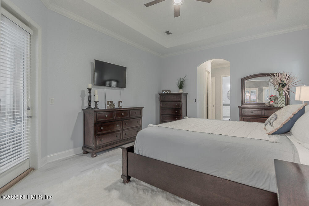 191 Enrede Lane St. Augustine, FL 32095 - Photo 32 of 44 a bedroom with a bed and a dresser