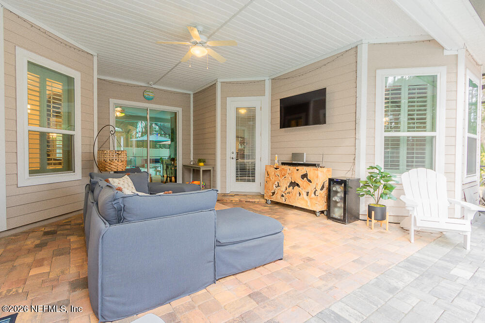 191 Enrede Lane St. Augustine, FL 32095 - Photo 36 of 44 a bedroom with furniture and large windows
