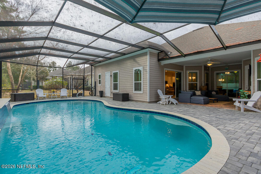 191 Enrede Lane St. Augustine, FL 32095 - Photo 39 of 44 a view of a swimming pool with outdoor seating
