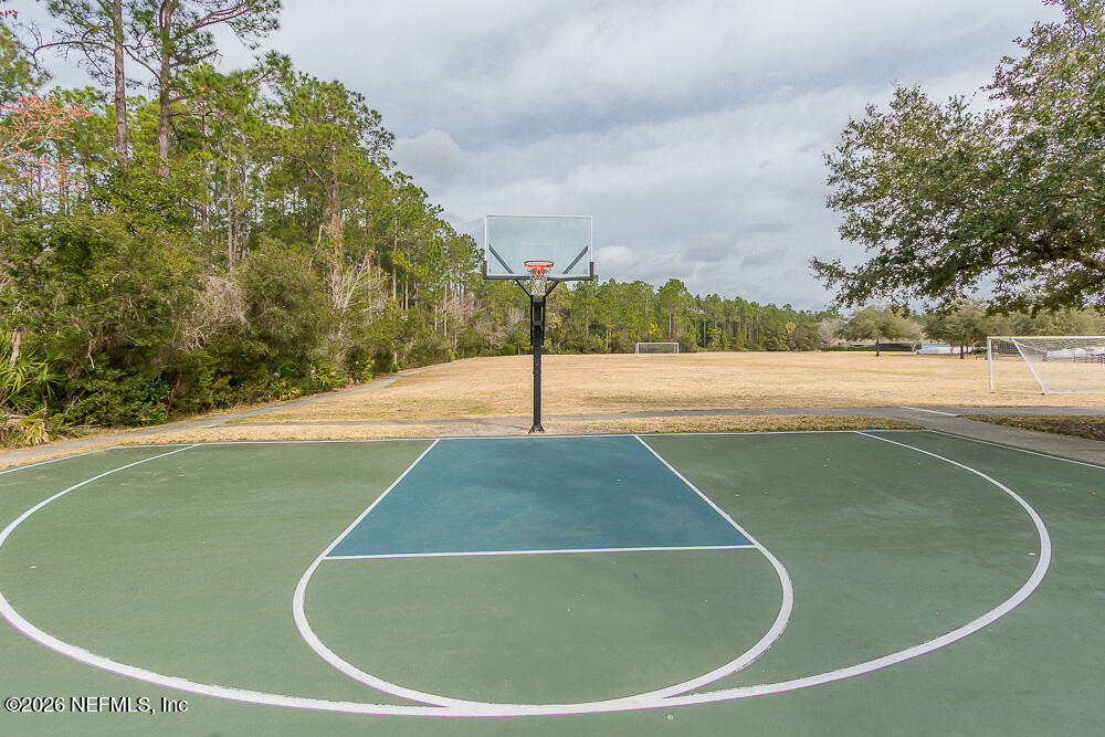 191 Enrede Lane St. Augustine, FL 32095 - Photo 43 of 44 a view of a swimming pool with a yard